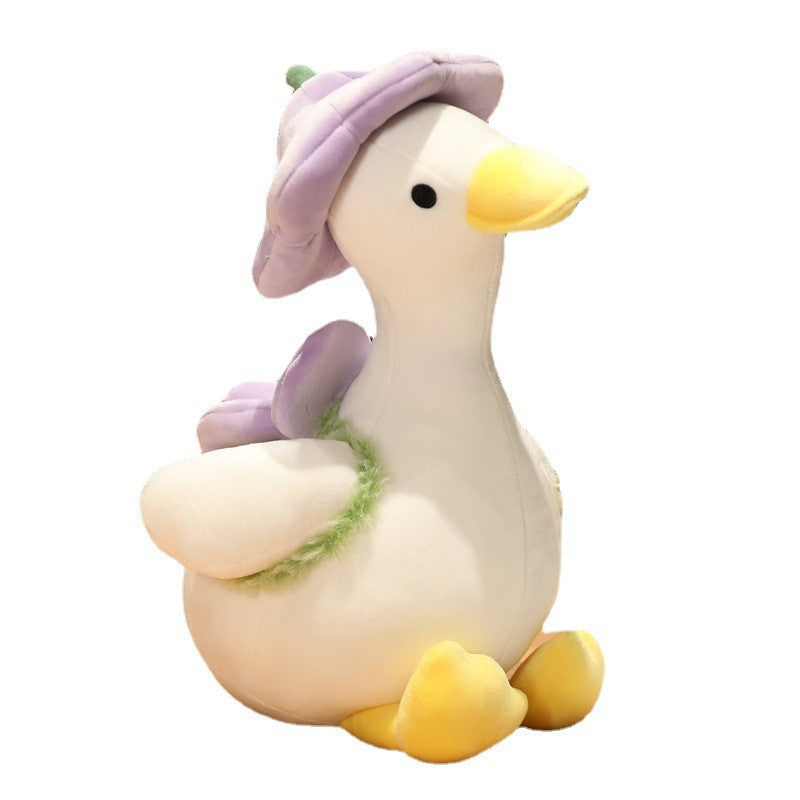 Duck stuffed animal wearing a flower hat
